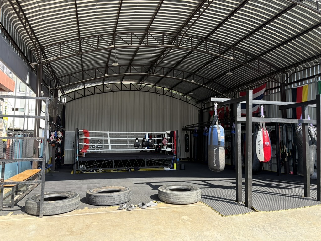 Ringside training area with tires at the gym