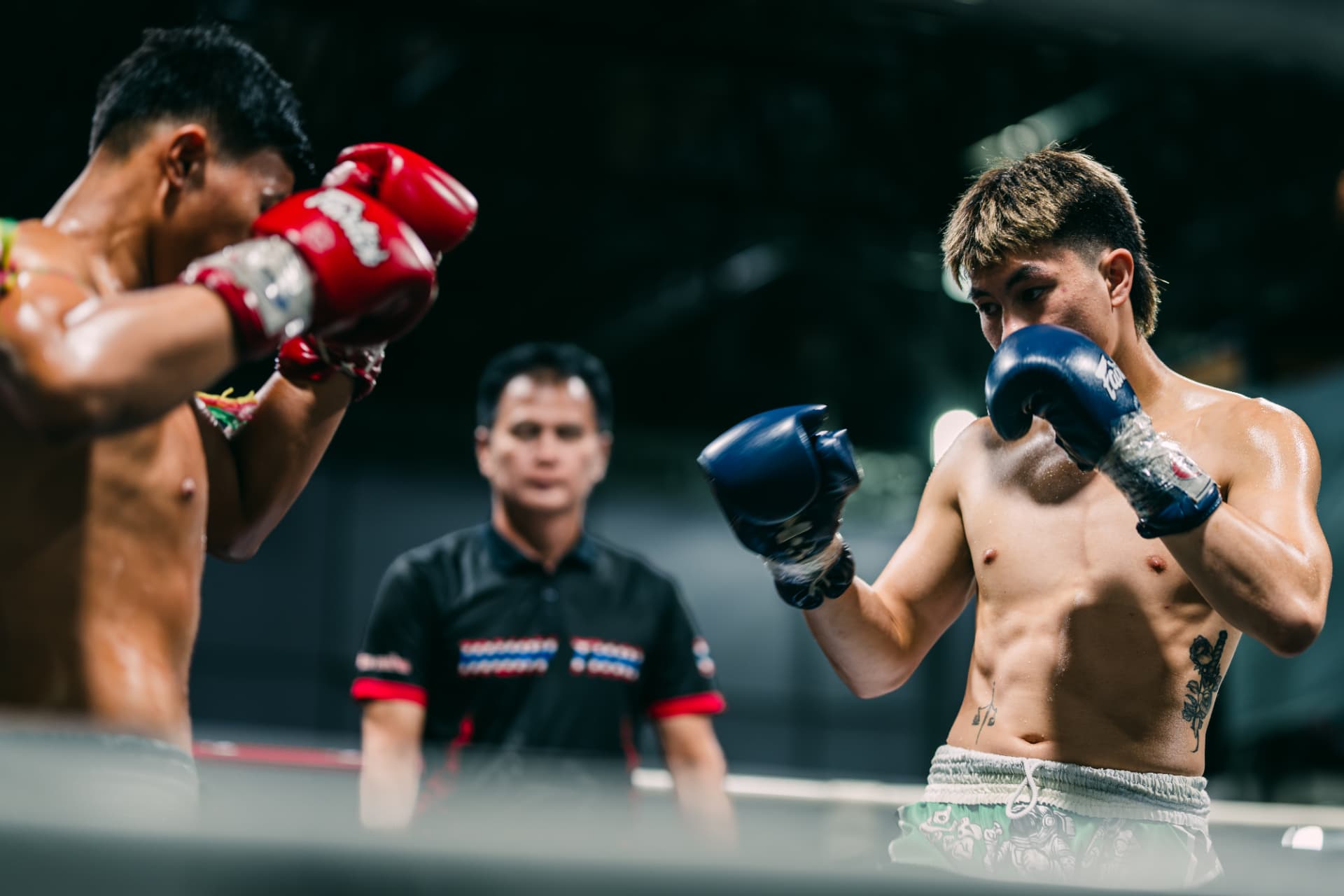 Joker fighting in the ring as an adult