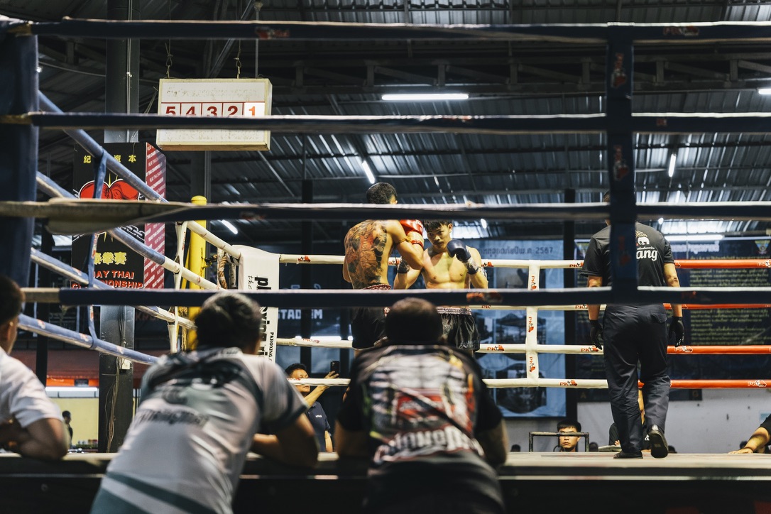Muay Thai stadium ring with scorecard above
