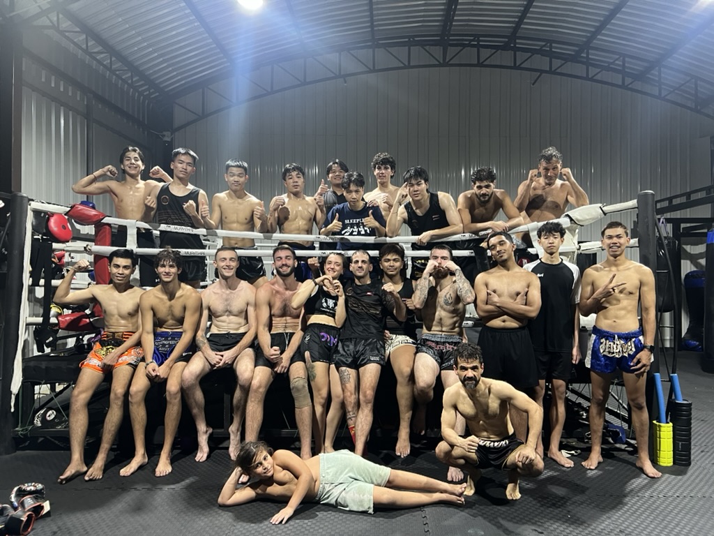 Changpuak Muay Thai team group photo in the ring